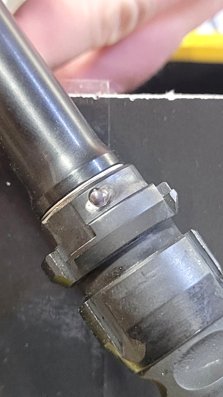 Close-up of completed pin and weld work